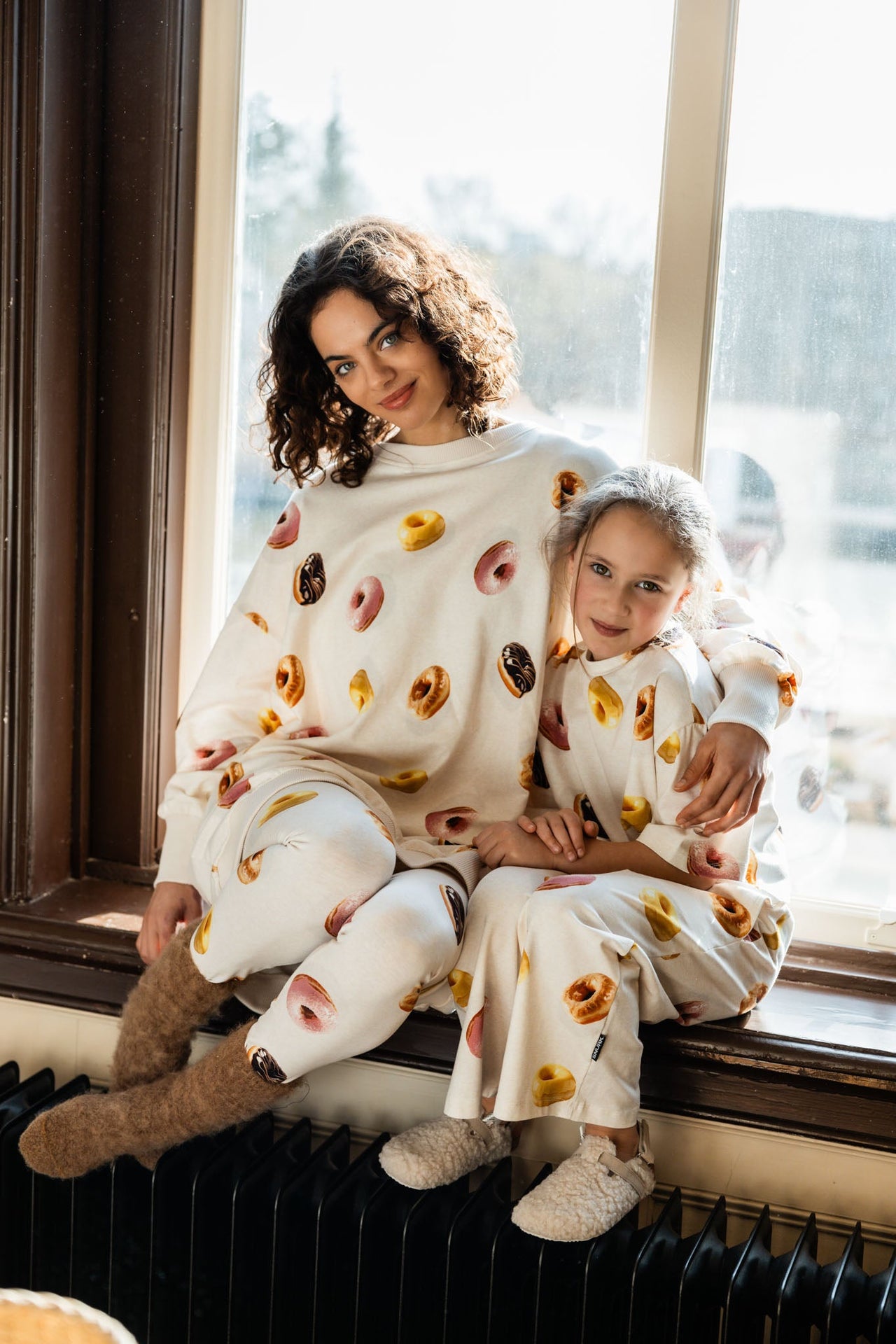 Woman and child wearing donut Pj's