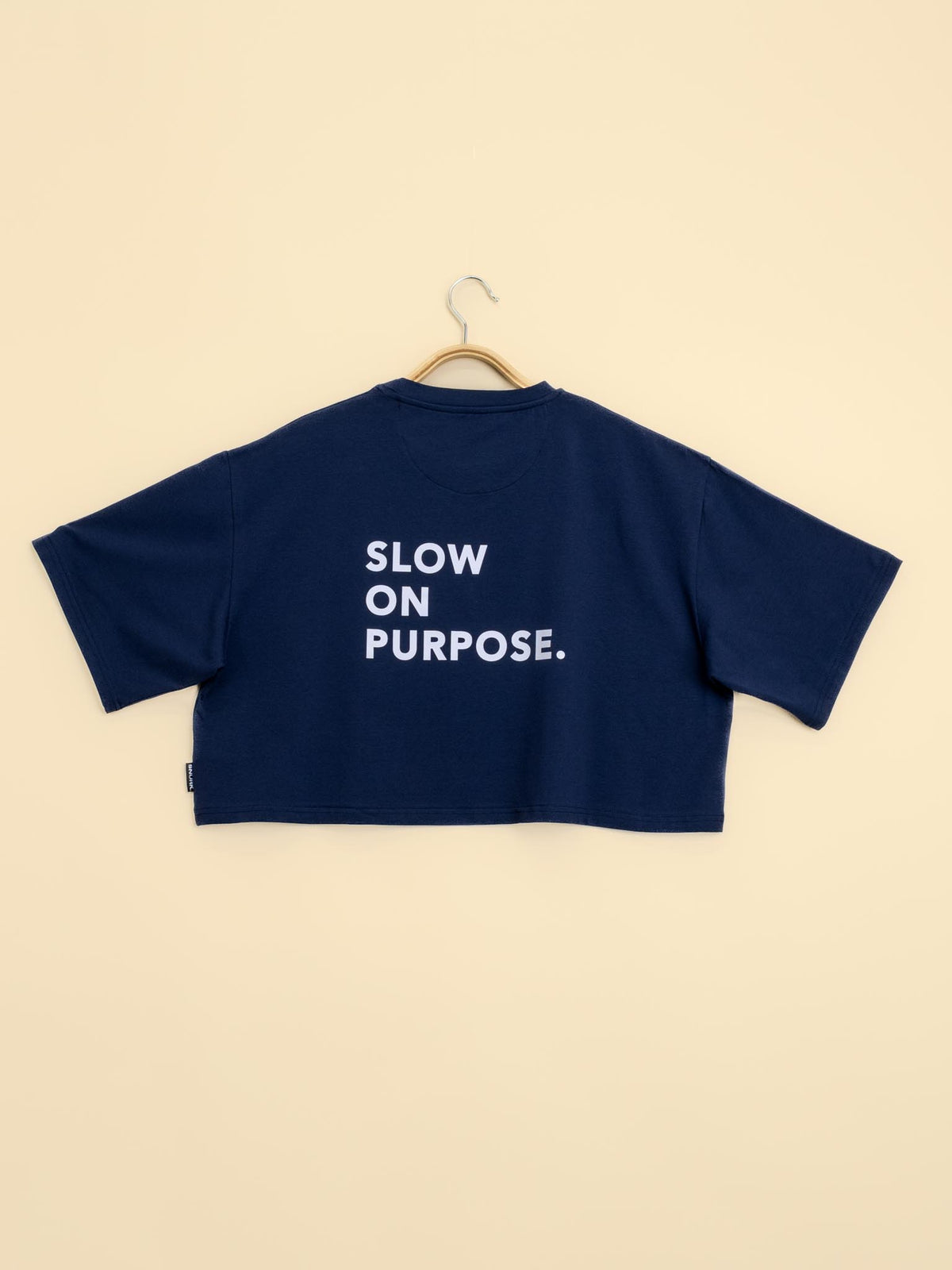 Navy Cropped Tee  with "Slow on Purpose" text in white on the back - SNURK
