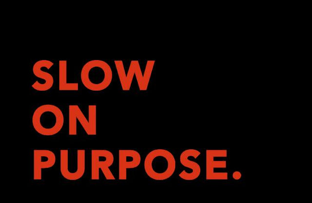 Slow on Purpose in Red on a black background - SNURK