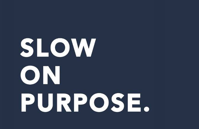 Slow on Purpose in white on a navy background - SNURK