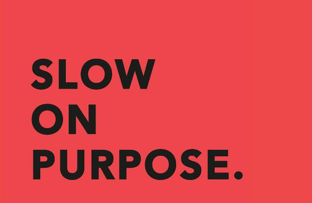 Slow on Purpose in Black on a red background - SNURK